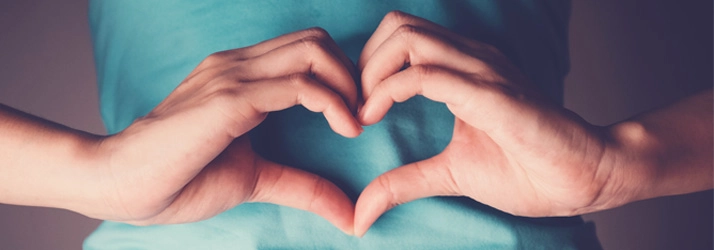 Chiropractic Chesterfield MI Heart Hands A person making a heart shape with their hands.