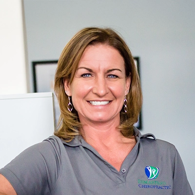 Lisa Lonsway smiling in a grey shirt.