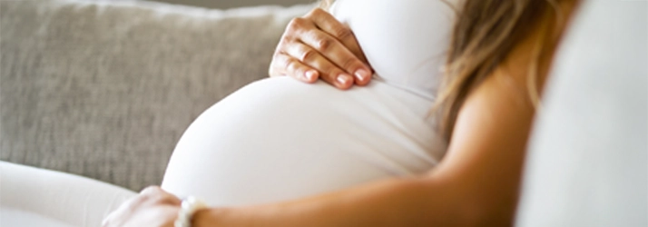 Chiropractic Chesterfield MI Pregnant Woman A pregnant woman holding her belly.