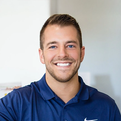 Chiropractor Steven Light smiling in a blue shirt.